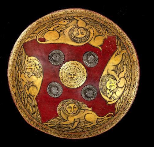 A Mughal painted leather Shield (dhal) North India, 19th Century