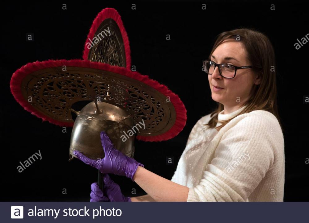 https://c8.alamy.com/comp/2APGEDC/amy-roberts-collections-officer-at-the-novium-museum-looks-at-the-recreated-helmet-of-the-bersted-man-during-a-preview-of-the-mystery-warrior-the-north-bersted-man-exhibition-at-the-novium-museum-in-chichester-the-warrior-thought-to-date-from-50bc-was-discovered-12-years-ago-in-an-elaborately-equipped-warrior-grave-during-excavations-at-north-bersted-near-bognor-regis-in-2008-2APGEDC.jpg
